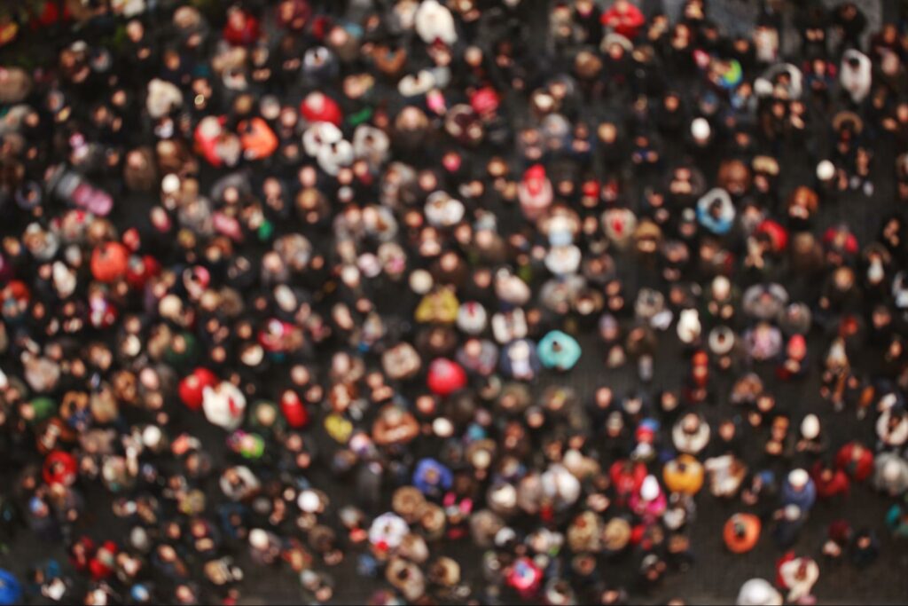 A blurred aerial shot of a crowd of people.