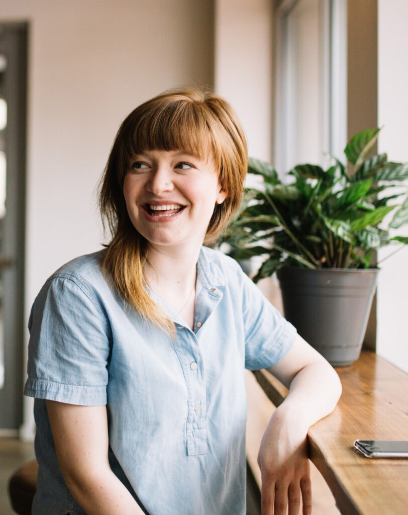 Woman excited about SEO ecommerce results on phone