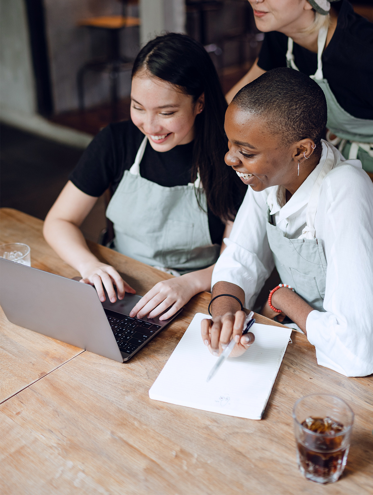 Three employees looking at SEO results for a bakery