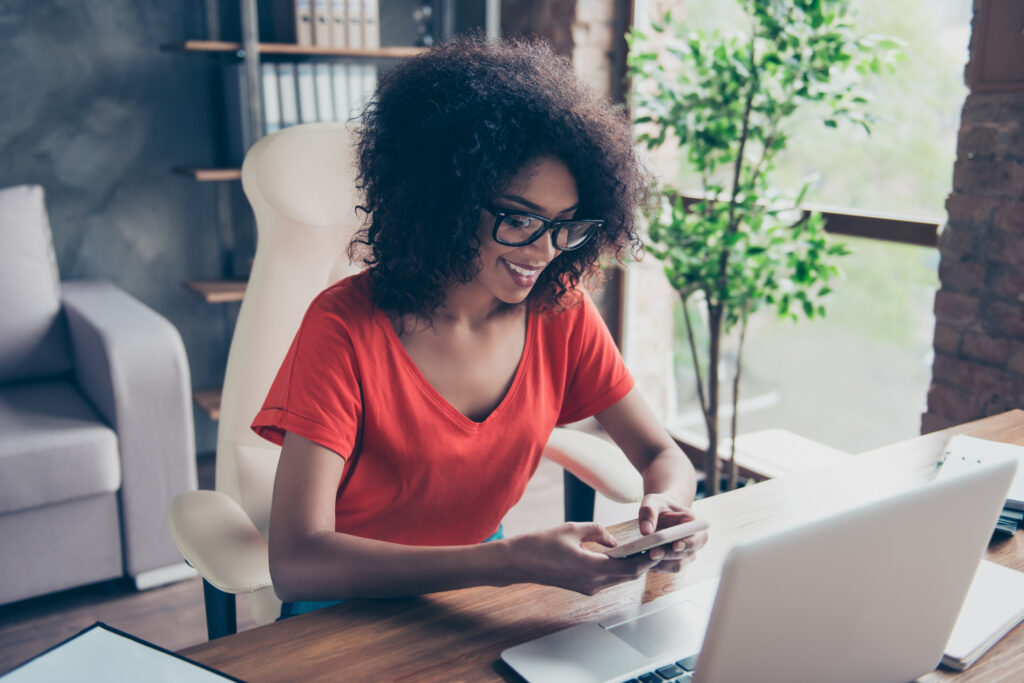 A woman checking her email for newsletters
