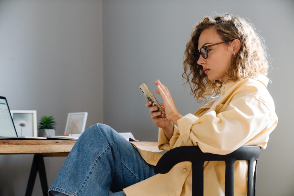 a woman scrolling tiktok on her phone
